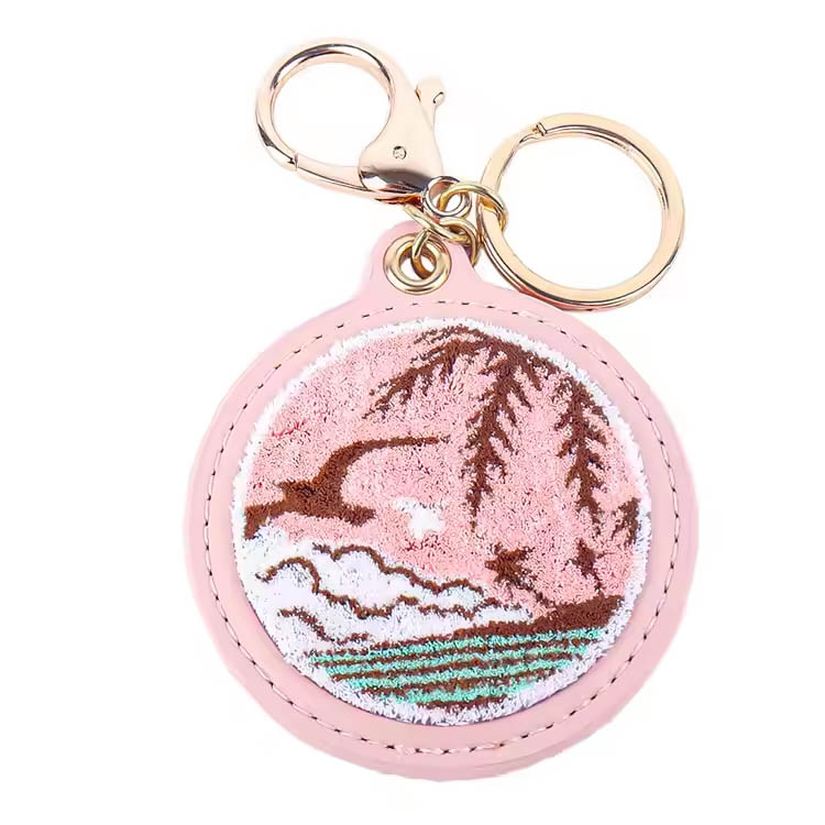Kľúčový prsteň ružový ostrov scenéria prémiový výšivok Keychain